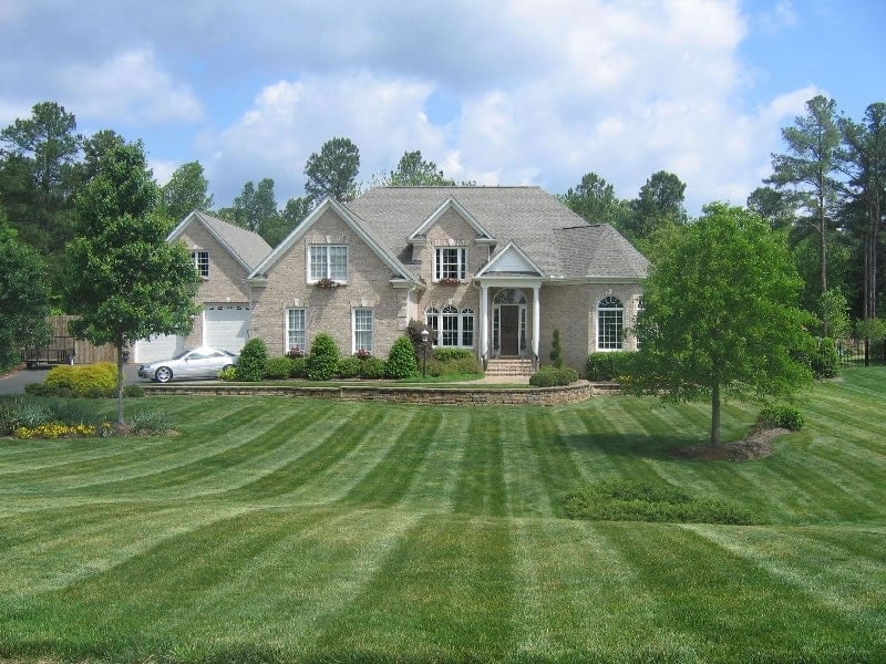 Triangle home with landscaped lawn