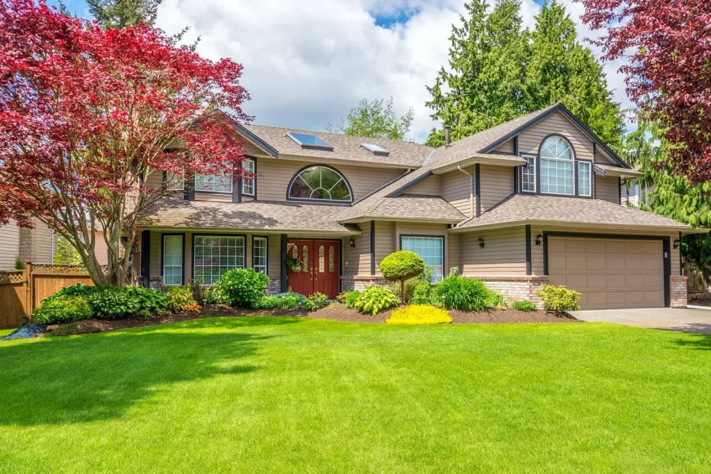 Luxury house with beautiful landscaping on a sunny day