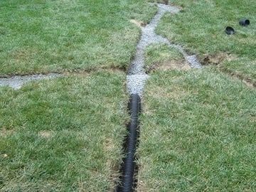 irrigation system piping in a lawn